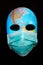 Textured mask with map  wearing surgical mask. Concept for corona virus pandemia