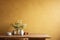 Textured mustard yellow wall copy space. Monochrome empty wall in kitchen with minimalist table. Wall scene mockup product for