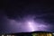 Textured night sky with bright lightning. Global warming