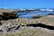 Textured rock pool of coastal seascape background