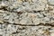 Textured stone background Rubble ballast in natural form in the rock wall