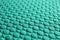 Textured turquoise fabric as background, closeup