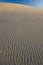 Textured windblown sand dune blue sky australia