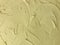 Textured yellow colored plaster. Wall stucco texture. Plastered background