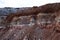 Textures of various clay layers underground in  clay quarry after  geological study of  soil. colored layers of clay and stone in