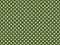 texturised white color polka dots over dark olive green backgrou