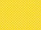 texturised white color polka dots over gold yellow background