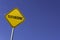 texturising - yellow sign with blue sky background