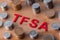 `TFSA` Tax Free Savings Account signs with coins in the background