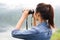 Thai adventure girl happy wathcing with binoculars