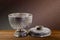 Thai antique ancient grunge silver bowl on wooden tabletop on vintage brown purple concrete wall background