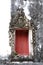 The Thai art stucco of ancient Window frame with red wood with Stucco floral vine pattern