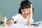 Thai Asian kid girls, aged 4 to 6 years old, look cute and bright. Healthy Sitting in the house studying She is writing a book and