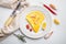 Thai  Asian omelette, fresh red chilli, brown and white crabmeat, lemon, Cheddar cheese, eggs, on plate, on white background, top