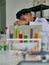 Thai Asian Young medical doctor  scientist man in laboratory testing for VIRUS infection sickness