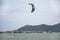 Thai athletes and foreigner people practicing sports and playing kiteboarding or sea kite in the ocean in Rayong, Thailand