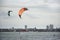 Thai athletes and foreigner people practicing sports and playing kiteboarding or sea kite in the ocean in Rayong, Thailand