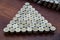 Thai Baht lots coin Arranged in triangle shape on with blurred background texture, Money stack for business planning investment an