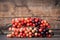 Thai blueberry on wooden background,Antidesma thwaitesianum