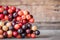 Thai blueberry on wooden background,Antidesma thwaitesianum