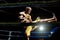 Thai boxer on boxing ring, kicking