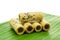 Thai coconut cracker roll on banana leaf.