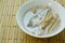 Thai coconut curry of steamed mackerel and lotus stems on bowl