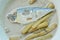 Thai coconut curry of steamed mackerel and lotus stems on bowl