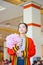 Thai college girl in academic gown is looking forward to the future in her graduation day