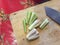 Thai cooking: Chopping fresh lemongrass on wooden cutting board