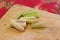 Thai cooking: Pounding, chopping fresh lemongrass on wooden cutting board