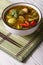 Thai cuisine: green curry chicken on the table. Vertical
