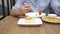 Thai cuisine - rice, omelet, vegetables with pork. a man eats Thai food in a restaurant. 4k, slow motion