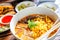 Thai Curried noodle soup Khao soi with chicken meat and spicy coconut milk