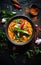 Thai curry with vegetables and spices in a bowl on a black background, AI