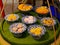 Thai desserts in a ceramic bowls placed and  displayed on a portable tray made of banana leaf