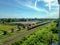 Thai diesel engine locomotive drives on the railway and pull the railroad track maintenance train and passenger bogies