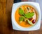 Thai duck curry soup in white bowl,