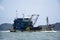 Thai fisher people sailing fishing boat ship in sea after catch fish and marine life in ocean of Phetra National Park to