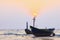 Thai fishery boat on sea beach against beautiful dusky sky use f