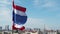 Thai Flag moving Slow motion with the wind on top of Bangkok city