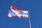 Thai flag on top flagstaff and sky background