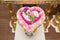 Thai flower heart shaped garland on golden tray with pedestal use for blessed water in Thai wedding ceremony