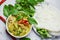 Thai food green curry chicken on soup bowl and thai rice noodles vermicelli with ingredient herb vegetable - asian food on the