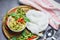 Thai food green curry chicken on soup bowl and thai rice noodles vermicelli with ingredient herb vegetable - asian food on the