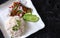 Thai food, Stir-fried menu with canned fish curry with rice Ready to garnish, served with cucumber  in a white plate