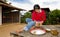 Thai girl removing coconut meat from shell