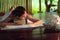 Thai girls therapist body spa massage and lying relaxation in business massaging and salon shop., Pretty attractive asian woman is