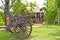 Thai house style and Old farmer wooden cart.