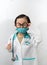 Thai kid boy with glasses and stethoscope and his hand hold syringe for injection in doctor gown or uniform with mask like